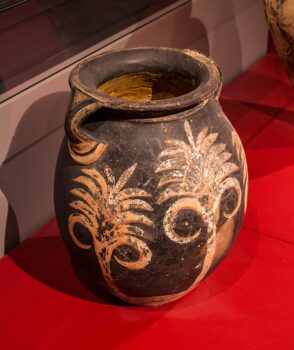 Photo of Minoan ovoid amphora with leafy pattern (maybe ferns) Made of pottery (clay) with dark (brown) painting on the unslipped buff surface - style / ware: Kamares style - period: middle minoan II B / protopalatial period (dating in the museum: 1800-1700 BC) -findspot: Phaistos, palace - museum / inventory number: Herakleion, Archaeological Museum - Please note: The above museum permits photography of its exhibits for private, educational, scientific, non-commercial purposes. If you intend to use the photo for any commercial aim, please contact the museum and ask for permission.