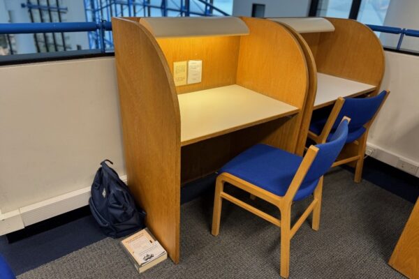 Photo of a cleared study carrel, with personal belongings removed