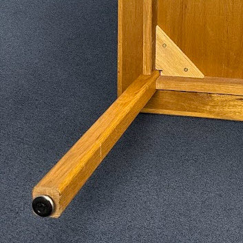 Tables reinforced with triangle wooden supports
