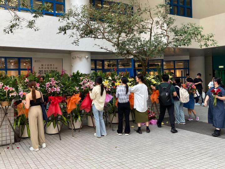 People taking flowers