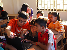 Teaching children at a village during the Cambodia Service Learning Trip