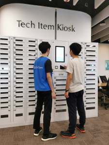 Student Helpers at tech item kiosk